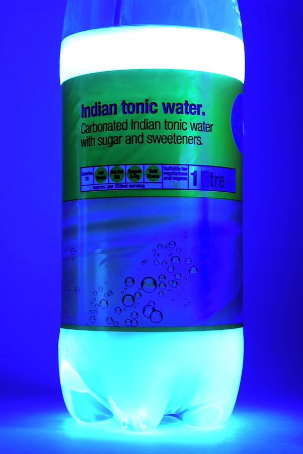 Bottle Photograph - Tonic Water Bottle In Uv Light by Cordelia Molloy/science Photo Library