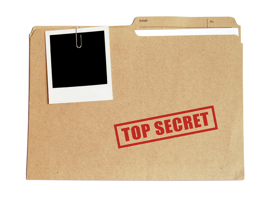 Top secret file in a folder with a Polaroid attached Photograph by Subjug