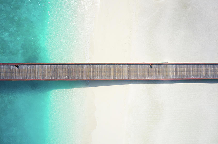 Top View Jetty Over Sandy Beach And Photograph by Amriphoto