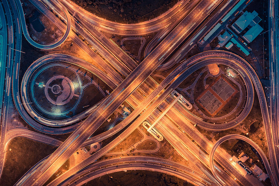 Top view of an infinity road, highway traffic and city Photograph by Sahacha Nilkumhang