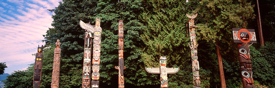 Architecture Photograph - Totem Poles In A Park, Stanley Park by Panoramic Images