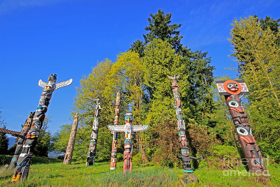 Totem Poles in Stanley Park Photograph by Charline Xia