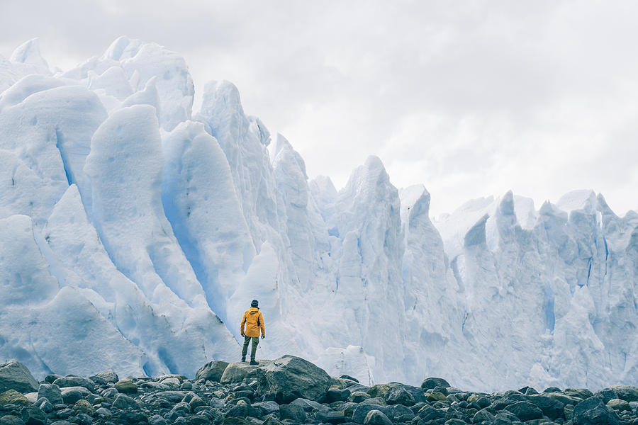 Tourist admiring the Perito Moreno glacier, Argentina Photograph by © Marco Bottigelli
