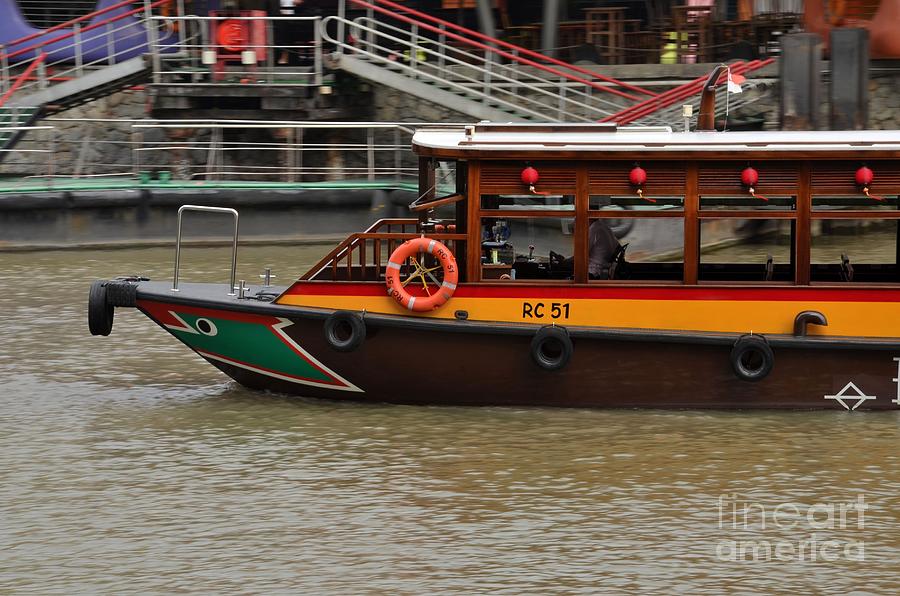 Tourist ferry bumboat vessel cruising Singapore River Photograph by Imran Ahmed