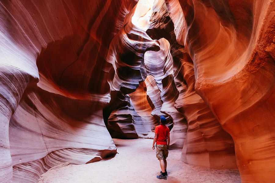 Tourist inside slot canyon, Arizona, USA Photograph by Matteo Colombo