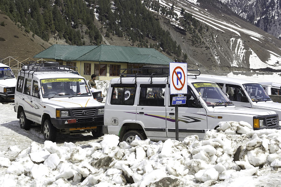 Tourist vehicles parked at the No Parking sign in Sonmarg Photograph by Ashish Agarwal