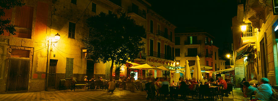 Architecture Photograph - Tourists At A Sidewalk Cafe, Majorca by Panoramic Images