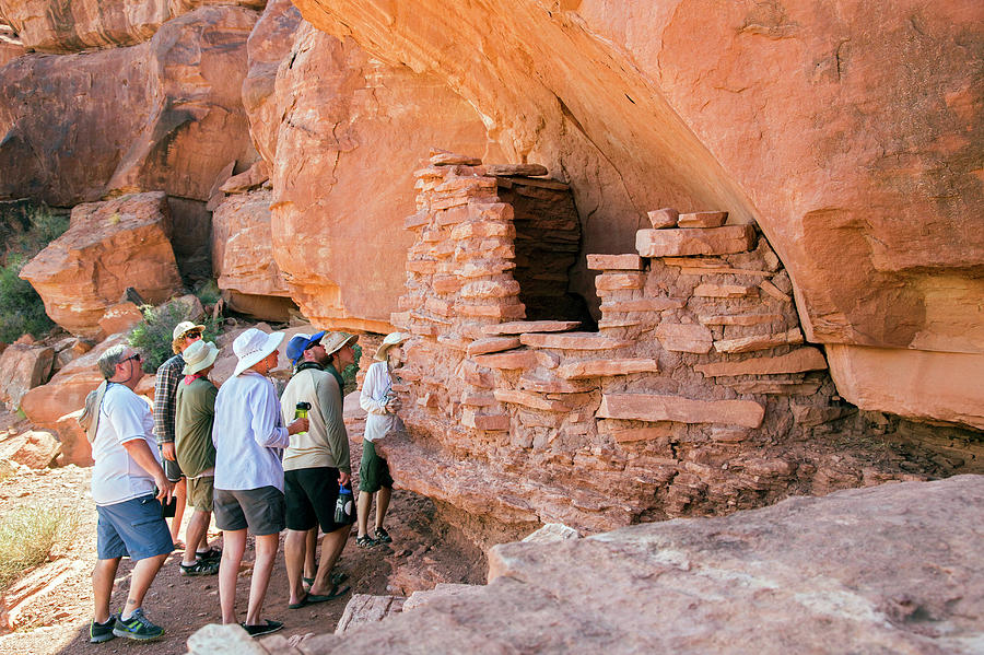 Tourists At An Anasazi Grain Store Photograph by Jim West