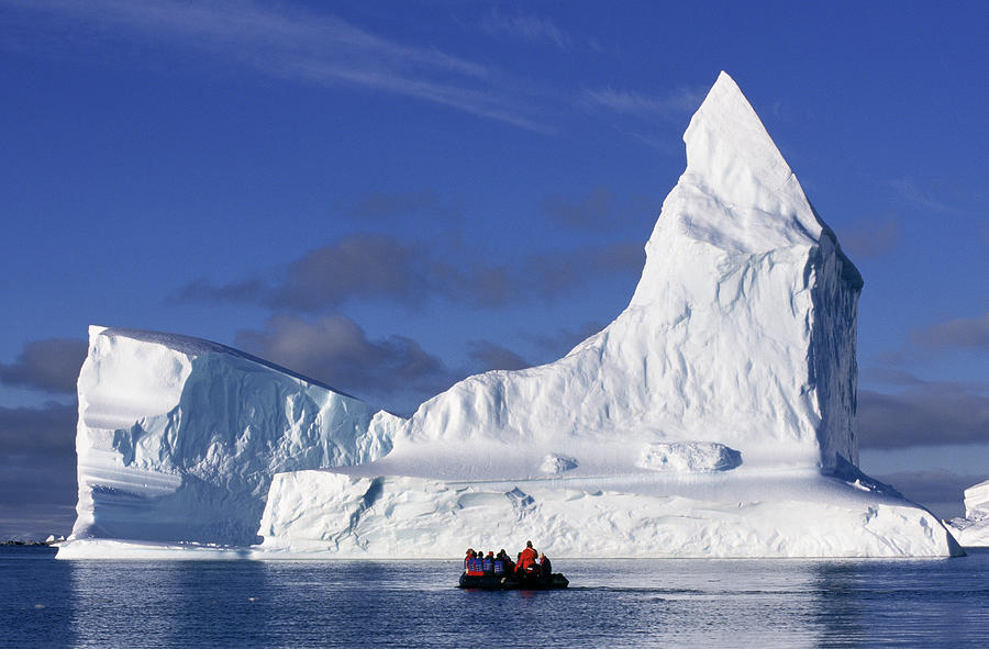 Nature Photograph - Tourists In Zodiac Near Iceberg by Rinie Van Meurs