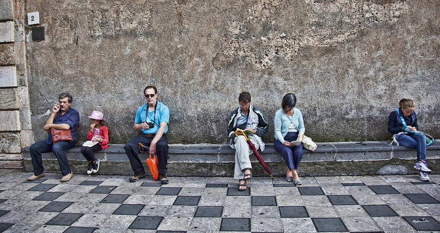Tourists On Bench 2 - Taormina - Sicily Photograph by Madeline Ellis