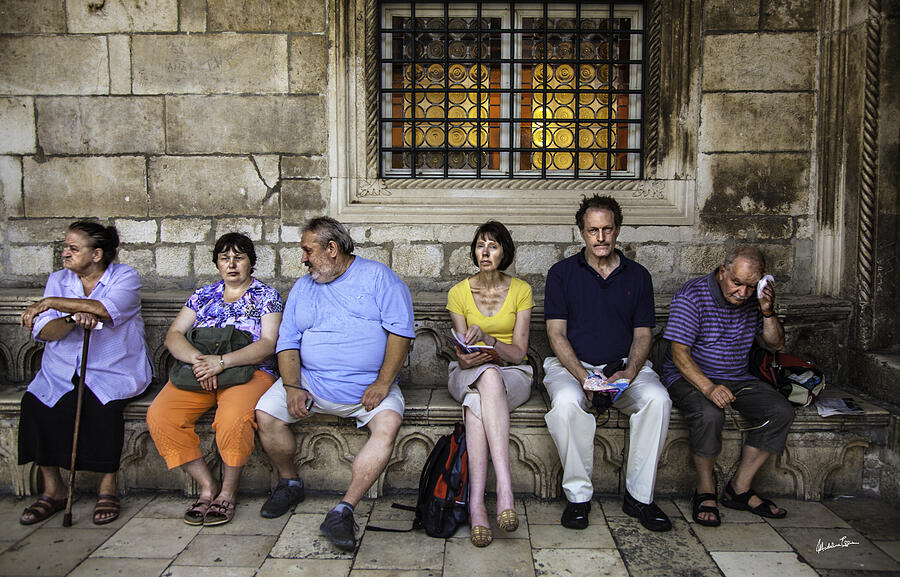 Tourists On Bench - Dubrovnik, Croatia Photograph by Madeline Ellis