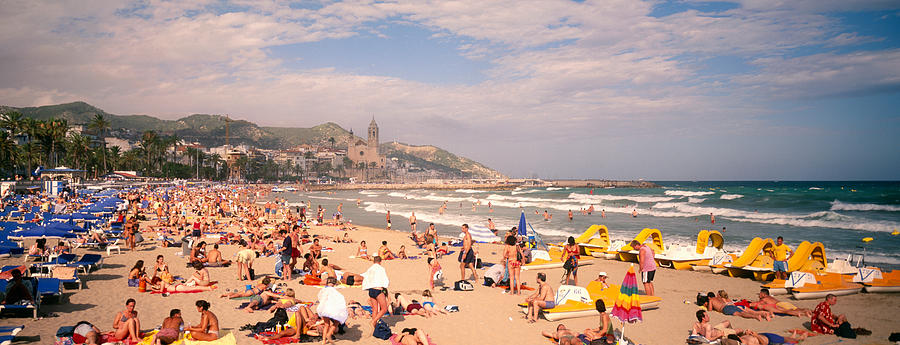 Color Image Photograph - Tourists On The Beach, Sitges, Spain by Panoramic Images