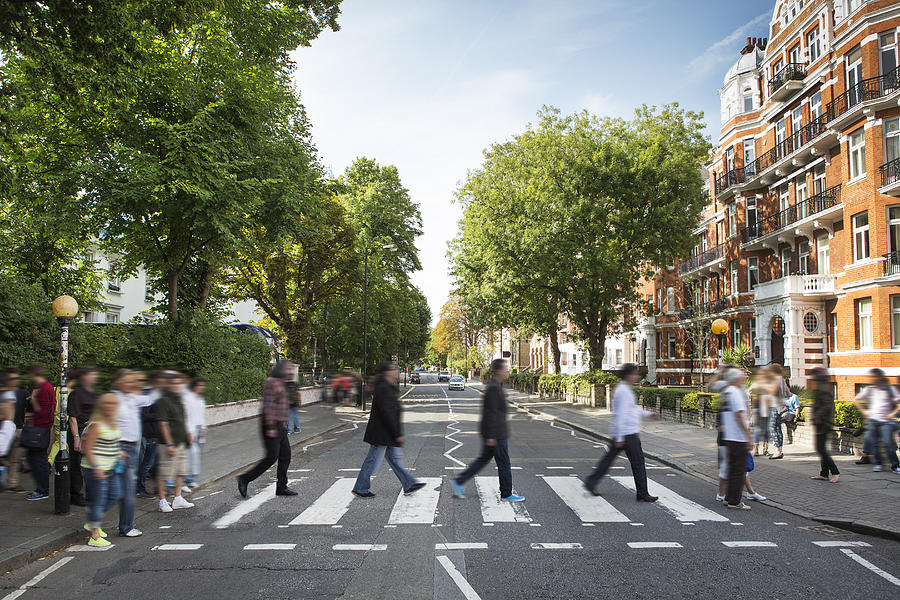 Tourists on the iconic Abbey Road zebra crossing Photograph by Richard Boll