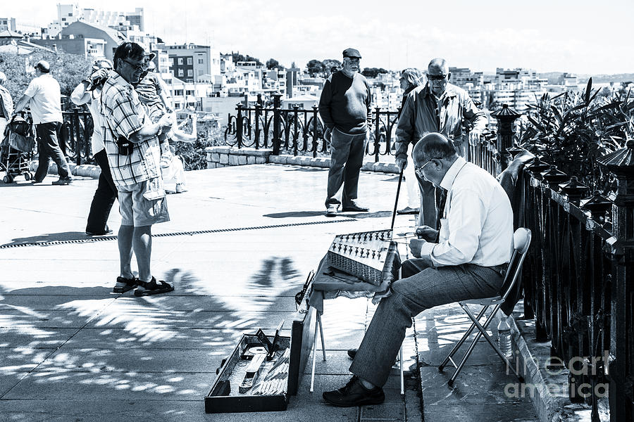 tourists watching busker playing santoor dulcimer at Tarragona S Photograph by Peter Noyce