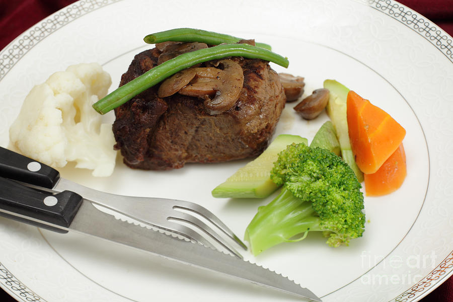 Tournedos meal with cutlery Photograph by Paul Cowan