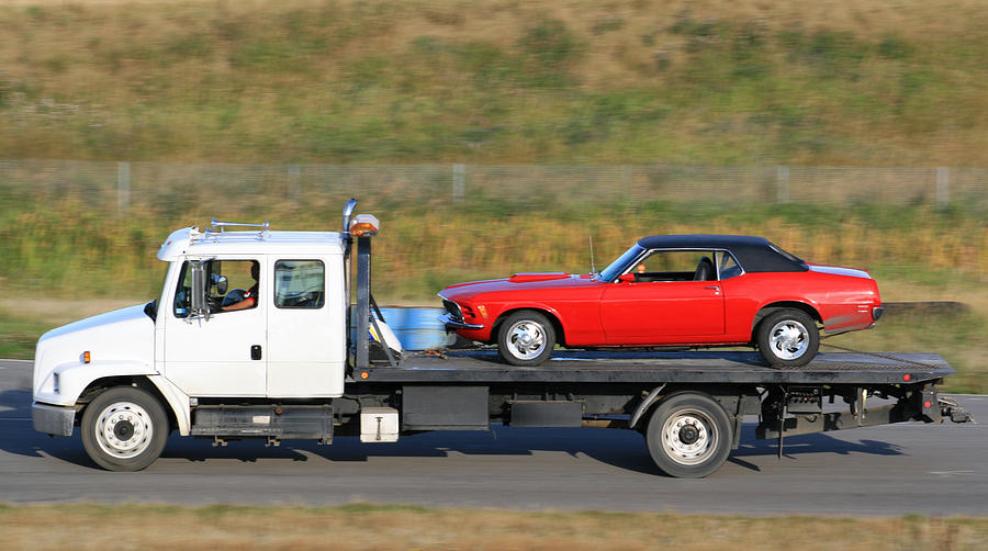 Tow Truck Hauling A New Red Car Photograph by ImagineGolf