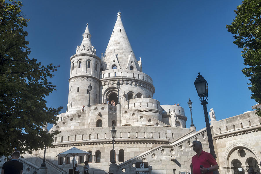 Towers of Fishermans Bastion and visitor in a red shirt, Budapest, Hungary Photograph by Izzet Keribar
