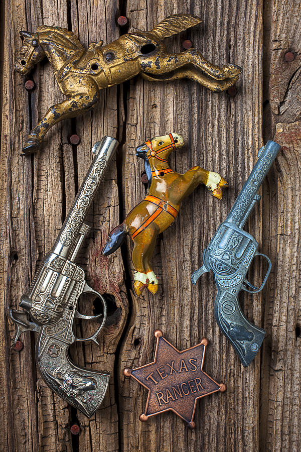 Toy Photograph - Toy guns and horses by Garry Gay