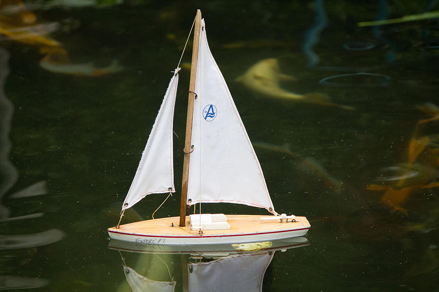 Toy sailboat Photograph by Susan Jensen