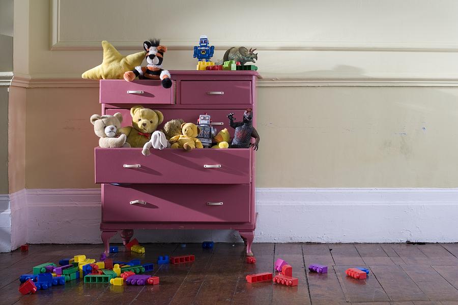 Toys in a dresser Photograph by Image Source