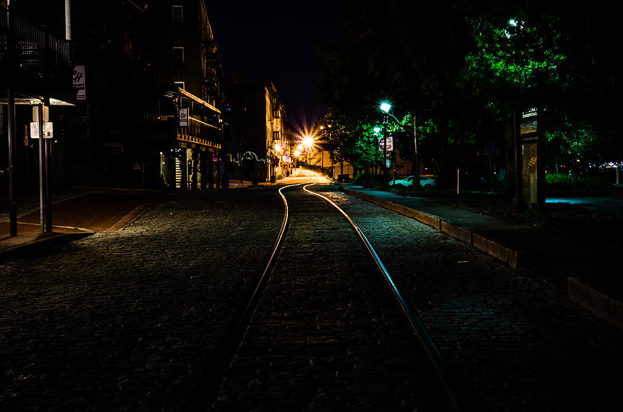 Tracks on the Riverwalk in Savannah  Photograph by Anthony Doudt