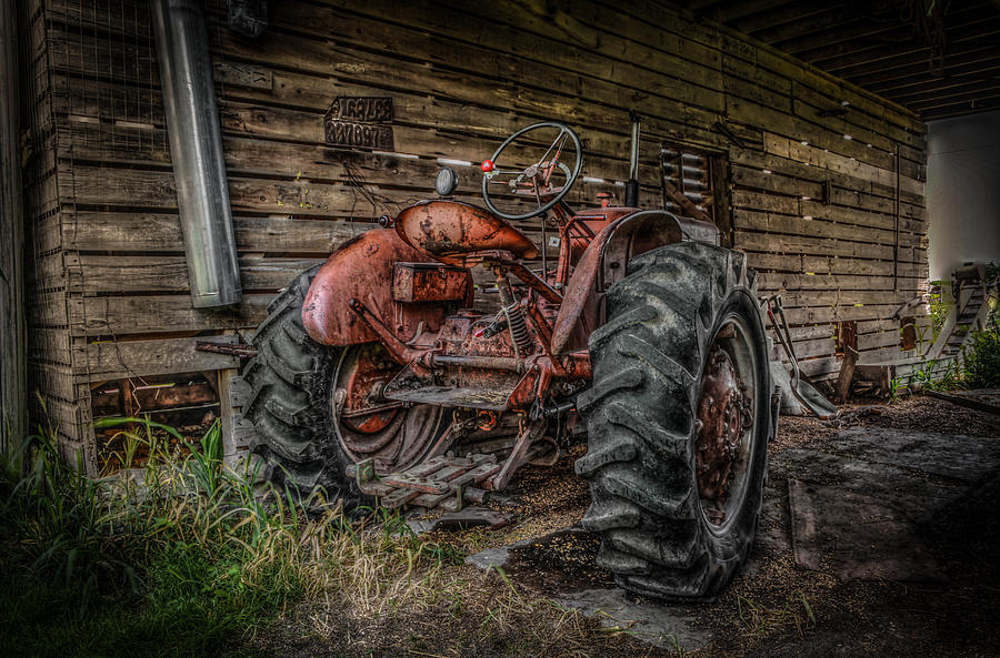 Tractor In The Crib Photograph by Ray Congrove
