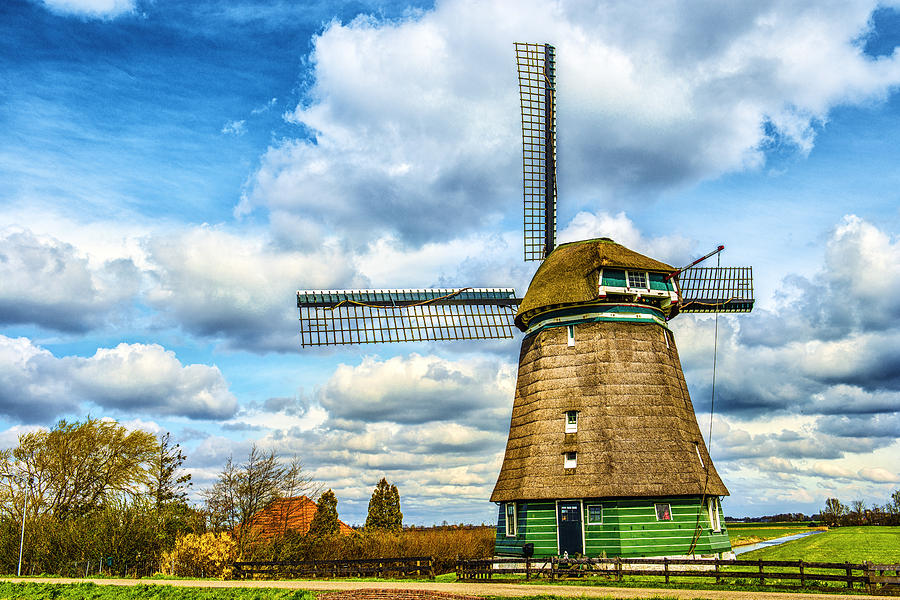 Traditional Dutch Windmill on a Typical Canal in Netherlands Photograph by AleksandarGeorgiev