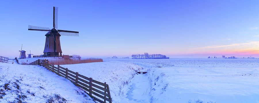 Traditional Dutch Windmills In Winter Photograph by Sara winter