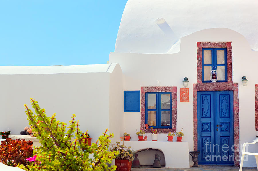 Traditional Greek house with blue door and windows Santorini Greece Photograph by Michal Bednarek