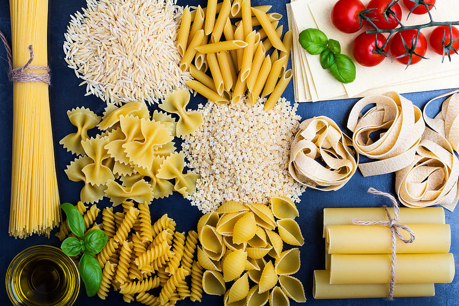 Traditional Italian pasta shapes background Photograph by Istetiana