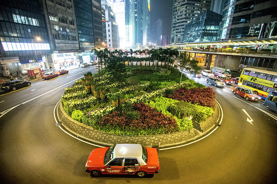 Traffic Around A Planted Roundabout In Photograph by James Morgan