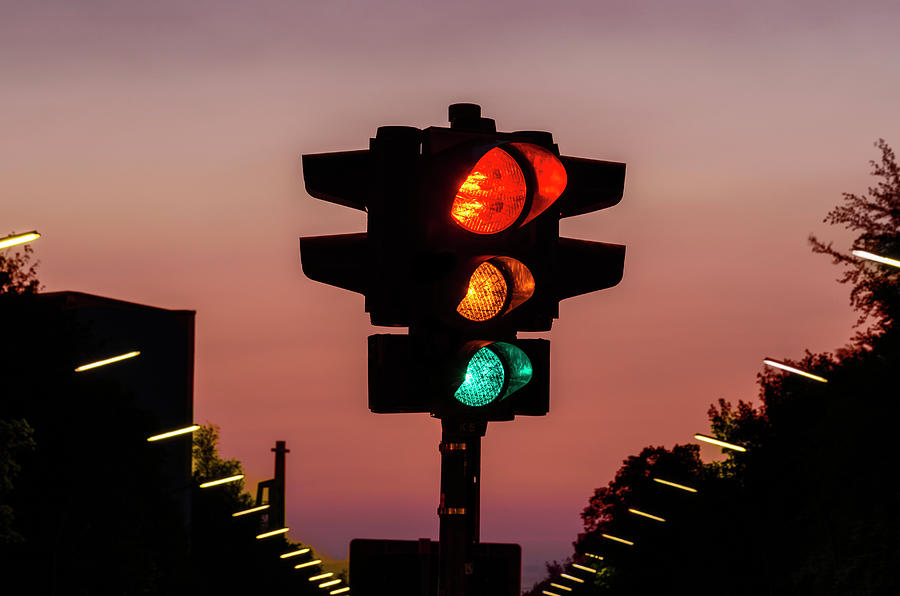Traffic Light At Sunset, All Lights On Photograph by Ingo Jezierski