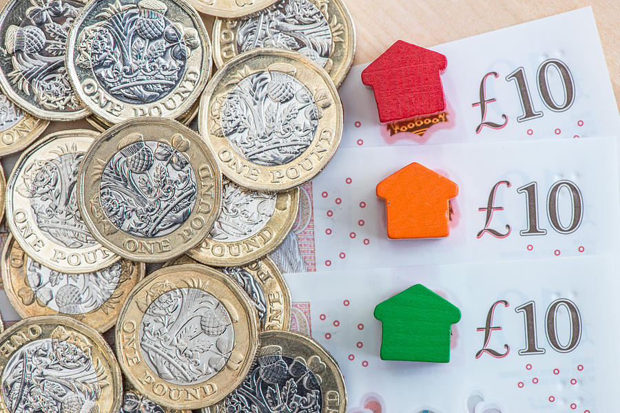 Traffic light colored model homes on £10 notes Photograph by Photo by Stuart Gleave