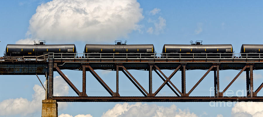 Train cars on the bridge Photograph by Les Palenik