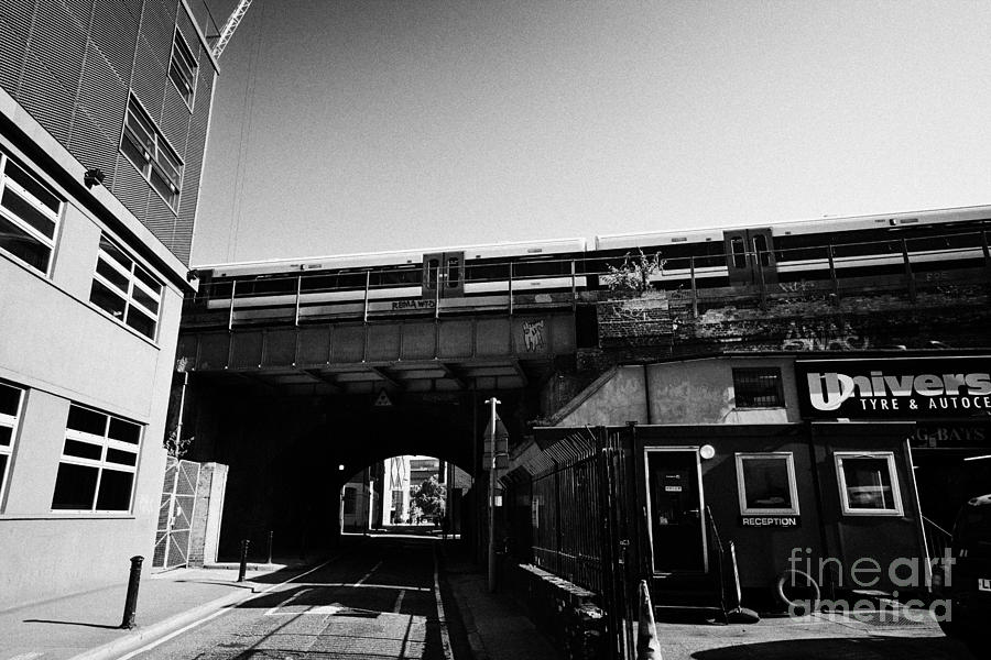 London Photograph - train going over railway bridge elevated section of track southwark London England UK by Joe Fox
