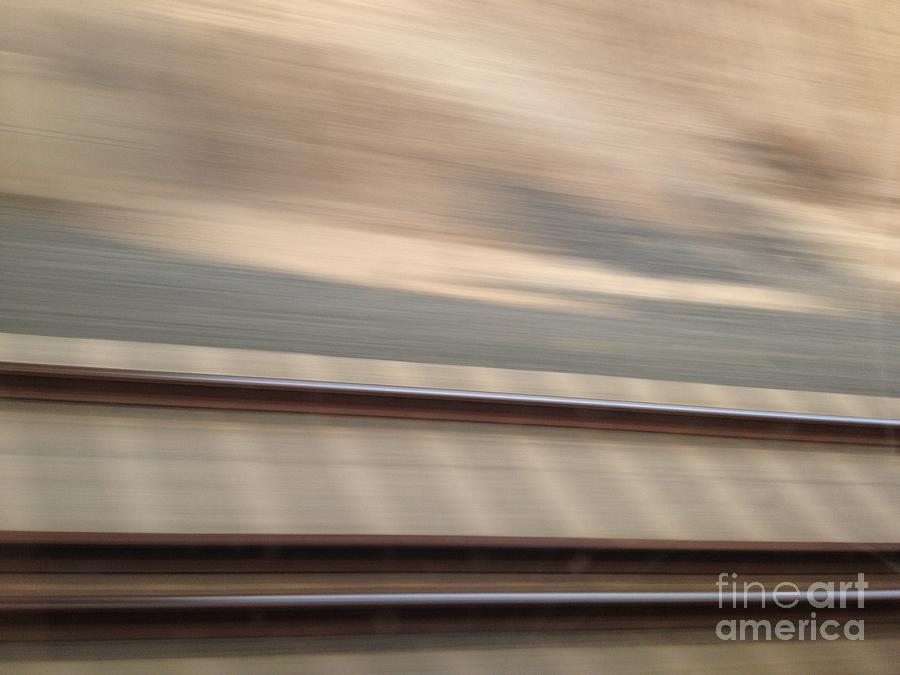 Train in motion - on the way to San Diego Photograph by Nora Boghossian