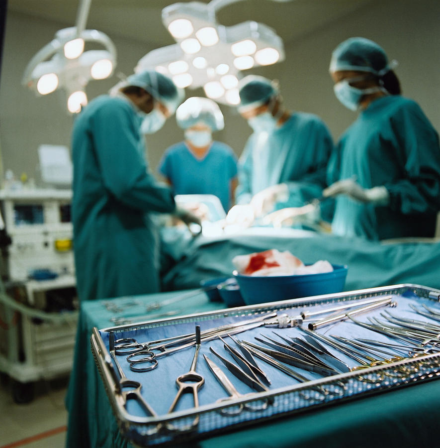 Tray of medical instruments in operating room Photograph by Paul Harizan