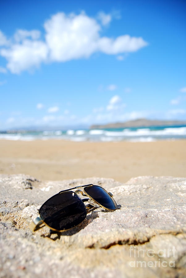 Trendy sunglasses on beach Photograph by Antony McAulay