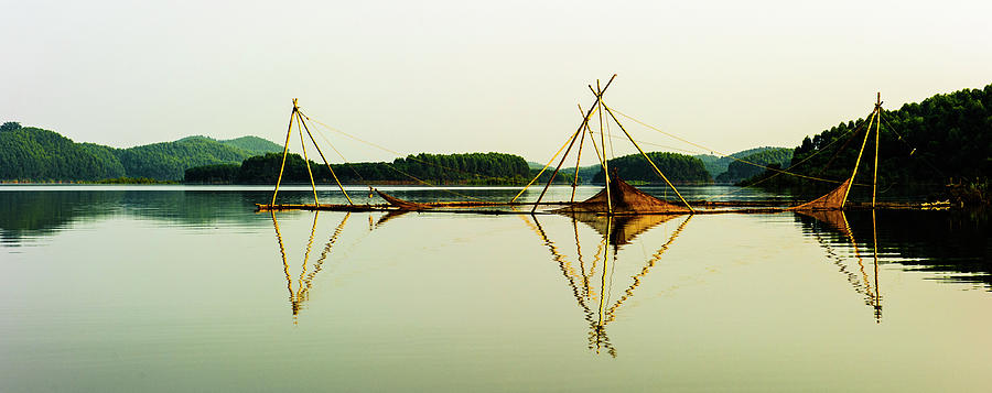 Triangles Of Bamboo Stick On Lake Photograph by Pham Le Huong Son