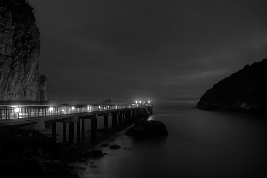 Trinidad Pier at Night - Monochrome Photograph by Mark Alder