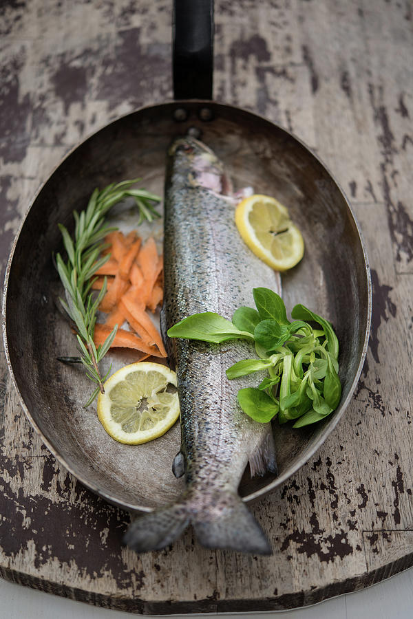 Trout With Carrots And Lemon In A Pan Photograph by By Foodograph.at