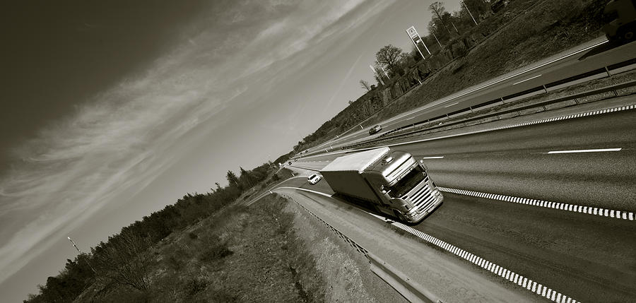 Truck In Fast Motion On Freeway Photograph by Christian Lagereek