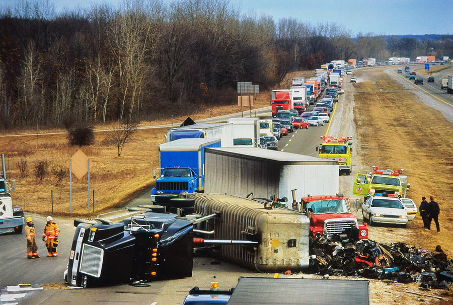 Truck overturned on highway, traffic jam behind Photograph by Andy Sacks