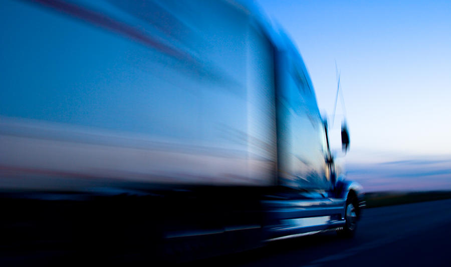 Truck speeding down the freeway at dusk Photograph by Epicurean Truck speeding down the freeway at dusk Photograph by Epicurean