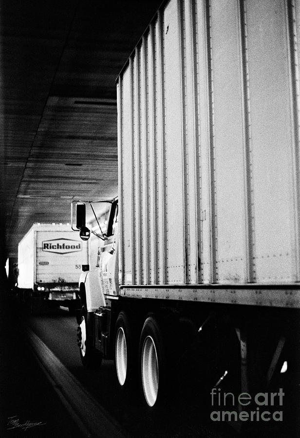 Black And White Photograph - Truck Traffic in Tunnel by Tom Brickhouse
