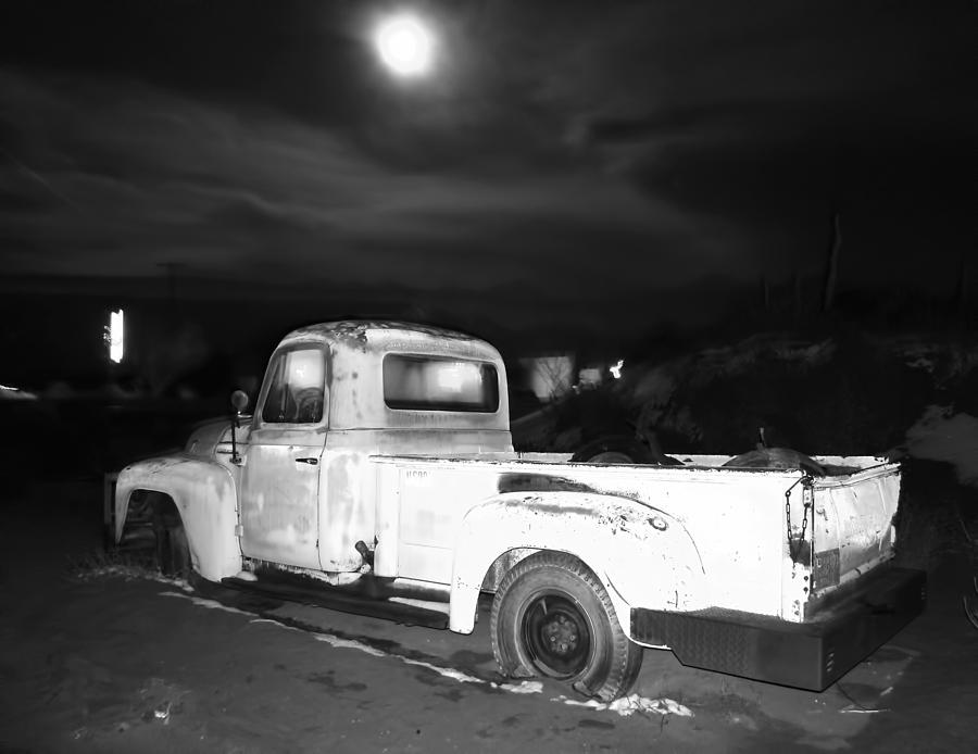 Truck under full moon bw Photograph by Cathy Anderson