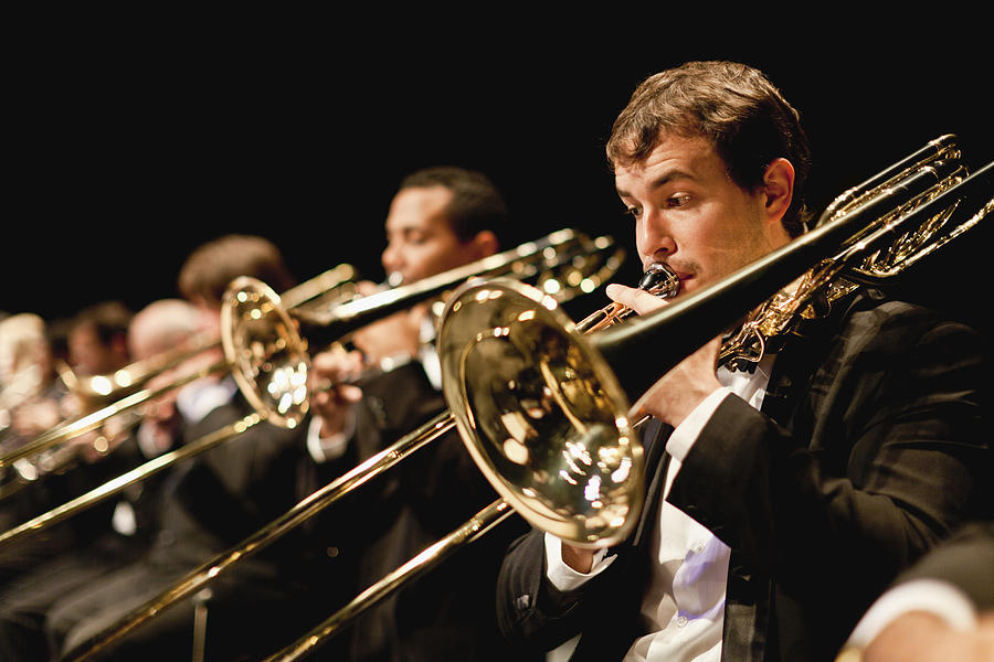 Trumpet players in orchestra Photograph by Photo_Concepts