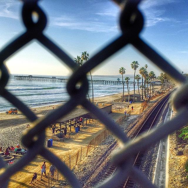 Pier Photograph - San Clemente Through The Fence by Hal Bowles