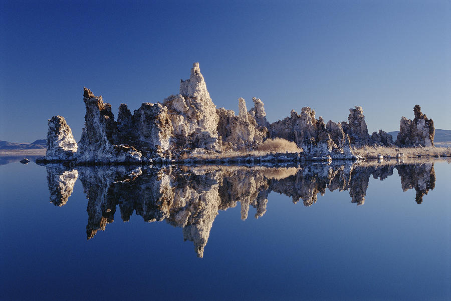 Tufa Reflected In Mono Lake California Photograph by Gerry Ellis