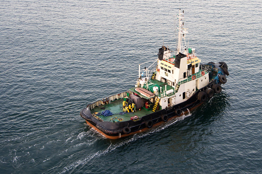 Tug boat helping ships in the harbor Photograph by John Trax | Fine Art ...